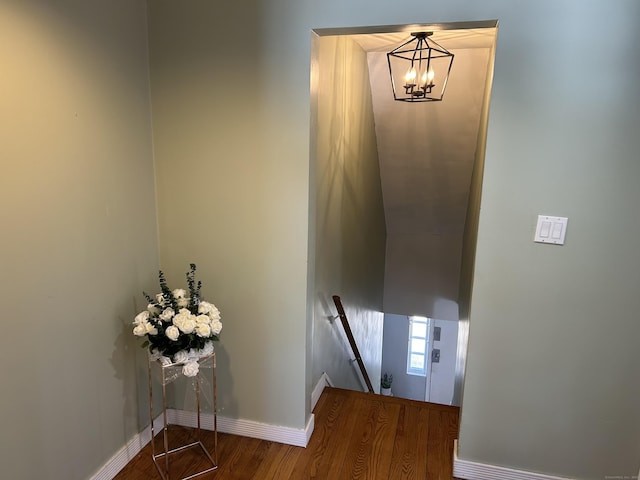 stairs featuring baseboards and wood finished floors