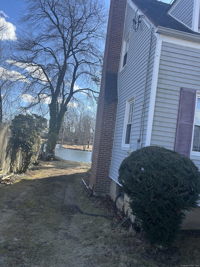 view of home's exterior featuring a chimney