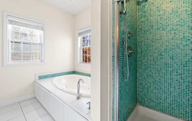 bathroom featuring tile patterned floors and separate shower and tub