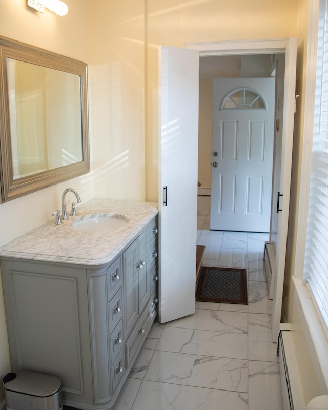 bathroom with vanity and a baseboard radiator