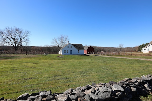 view of yard with a rural view