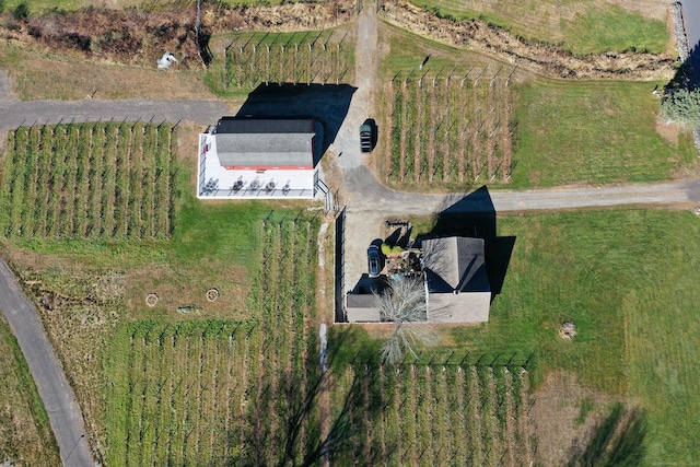 birds eye view of property with a rural view