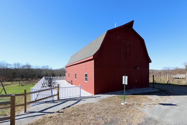 view of outbuilding featuring a rural view