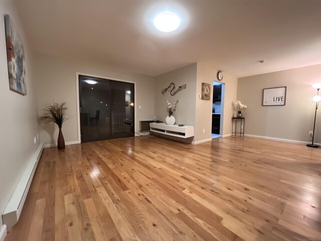 entryway with baseboard heating and light hardwood / wood-style floors