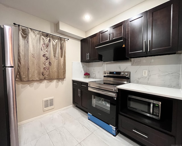 kitchen featuring light stone countertops, dark brown cabinets, backsplash, and stainless steel appliances