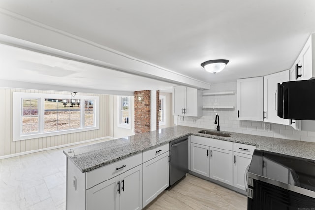 kitchen featuring white cabinetry, kitchen peninsula, and dishwasher