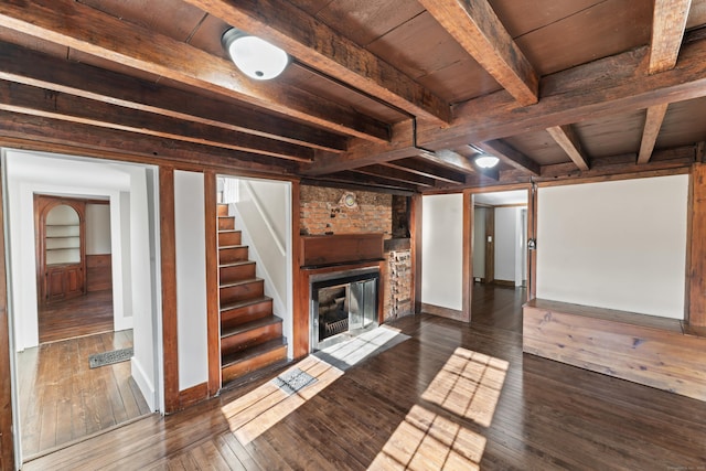 basement with a fireplace, dark wood-type flooring, and wooden ceiling