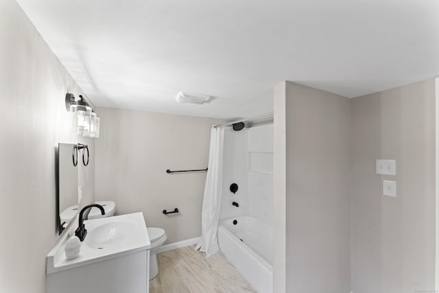 full bathroom with vanity, toilet, and shower / bath combo with shower curtain