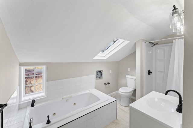 bathroom with vaulted ceiling with skylight, a relaxing tiled tub, vanity, and toilet