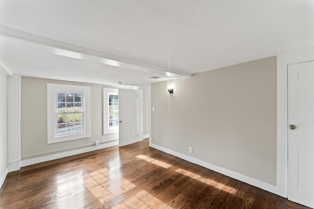 spare room with hardwood / wood-style floors