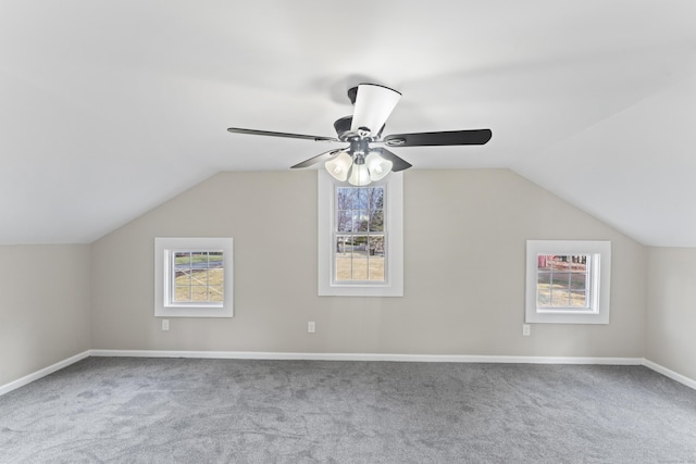 bonus room featuring ceiling fan, vaulted ceiling, and light carpet