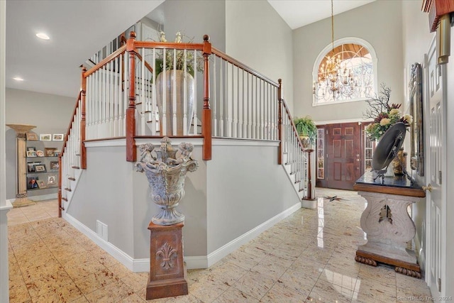 foyer featuring an inviting chandelier