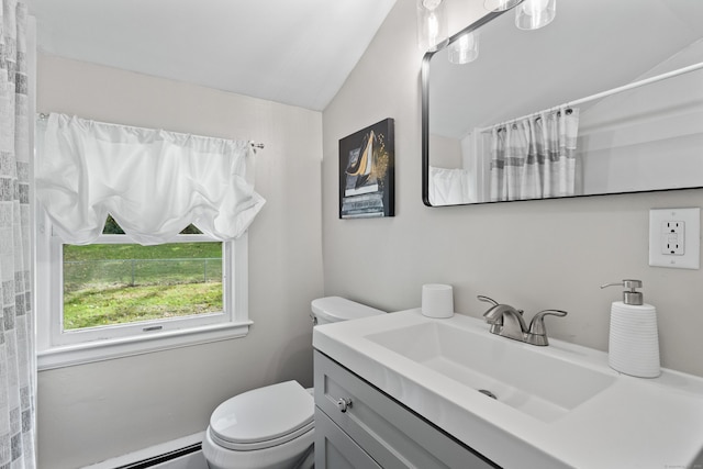 bathroom featuring vanity, toilet, baseboard heating, and vaulted ceiling