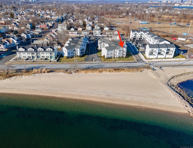 aerial view with a view of the beach and a water view