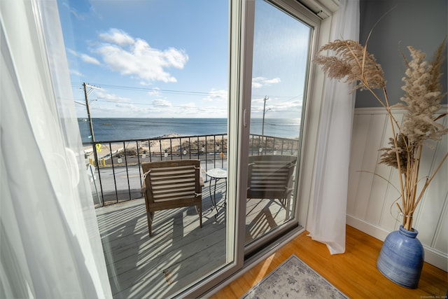 balcony featuring a water view