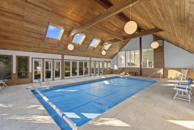 view of swimming pool with a skylight