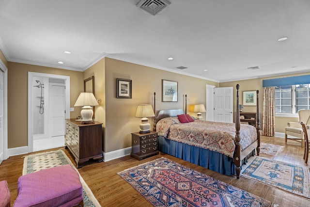 bedroom featuring hardwood / wood-style floors and ornamental molding