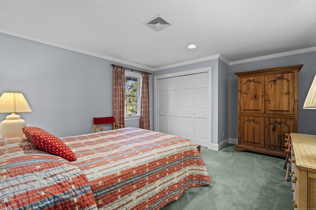 bedroom with carpet floors, crown molding, and a closet