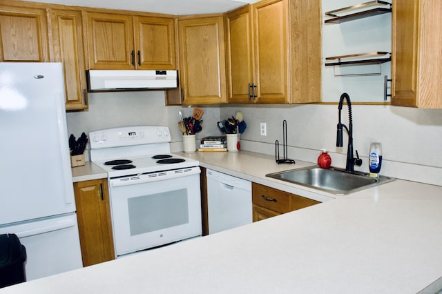 kitchen with white appliances and sink