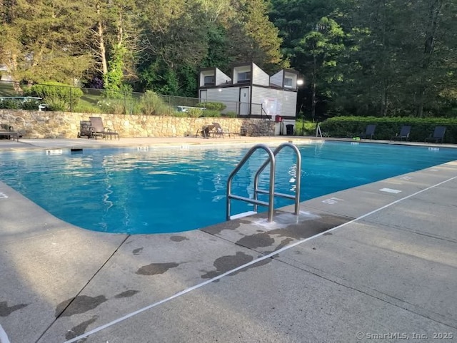 view of swimming pool featuring a patio