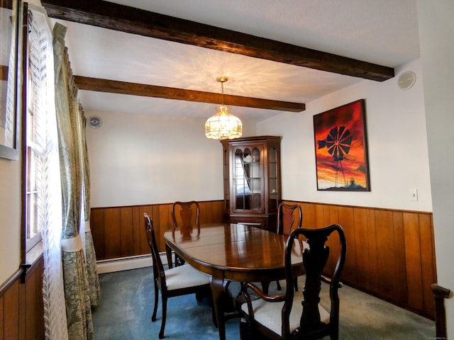 carpeted dining room featuring a baseboard heating unit, an inviting chandelier, and beam ceiling