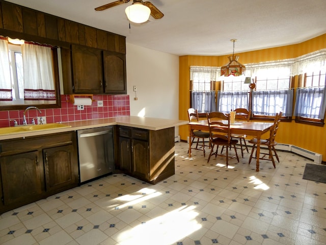 kitchen with sink, dishwasher, hanging light fixtures, dark brown cabinetry, and kitchen peninsula