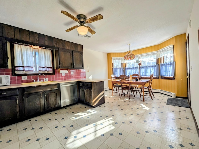 kitchen with sink, dishwasher, tasteful backsplash, dark brown cabinetry, and decorative light fixtures