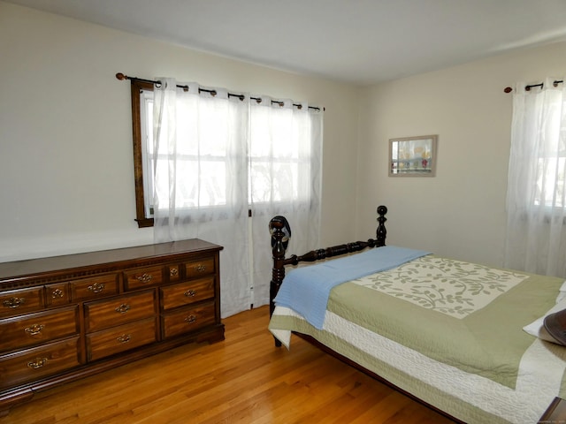 bedroom with light wood-type flooring