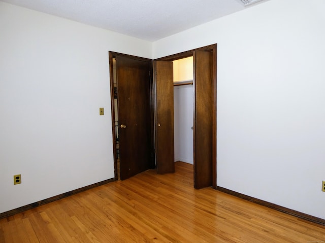 spare room featuring light wood-type flooring