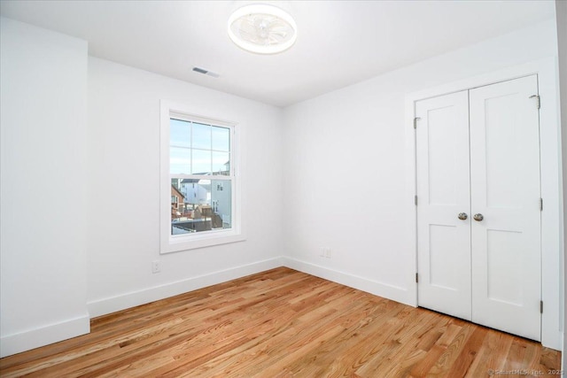 spare room with light hardwood / wood-style floors