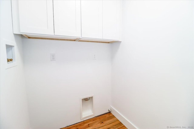 laundry room featuring cabinets, washer hookup, hookup for an electric dryer, and light hardwood / wood-style flooring