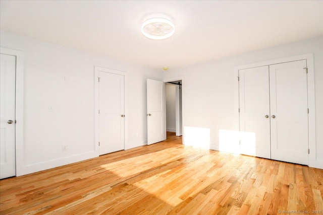 unfurnished bedroom with light hardwood / wood-style floors