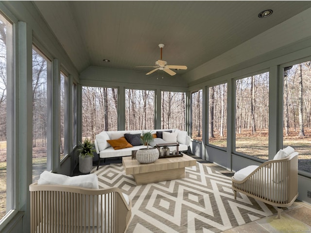 sunroom with ceiling fan, wood ceiling, and vaulted ceiling