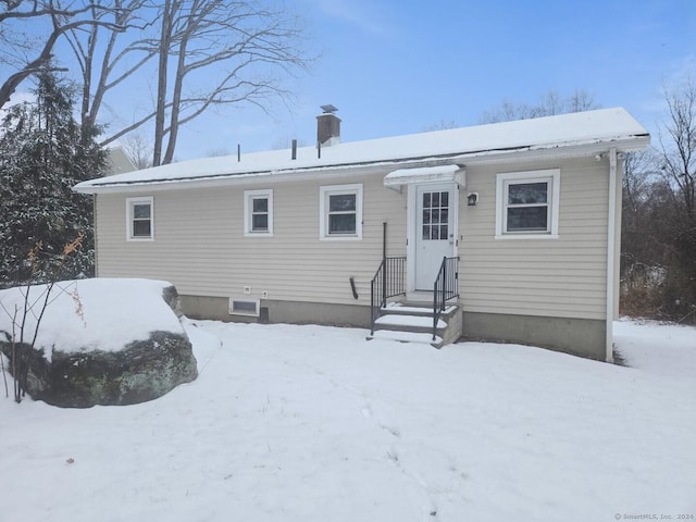 view of snow covered house