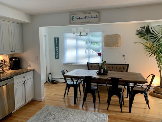 dining room with an inviting chandelier and light wood-type flooring