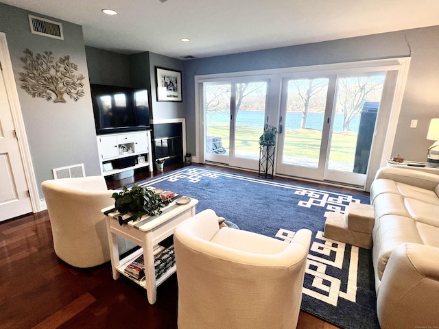 living room with dark hardwood / wood-style flooring