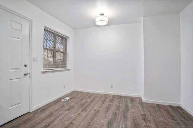 empty room featuring wood-type flooring