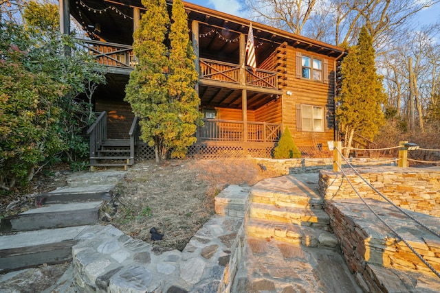 rear view of house featuring a balcony