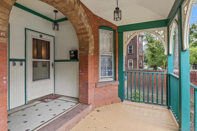 view of exterior entry featuring a porch