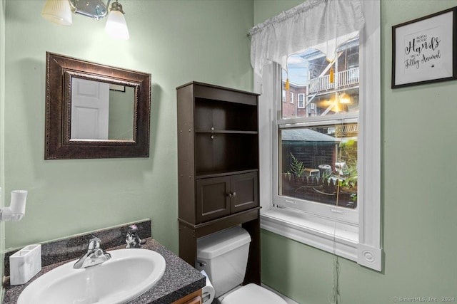 bathroom featuring vanity and toilet