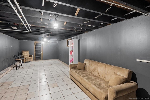 basement featuring tile patterned flooring