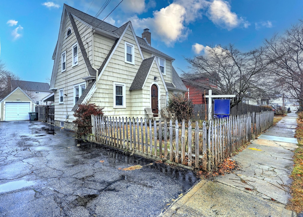 view of front of house with an outbuilding and a garage