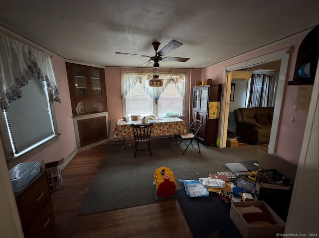 dining room with hardwood / wood-style flooring and ceiling fan