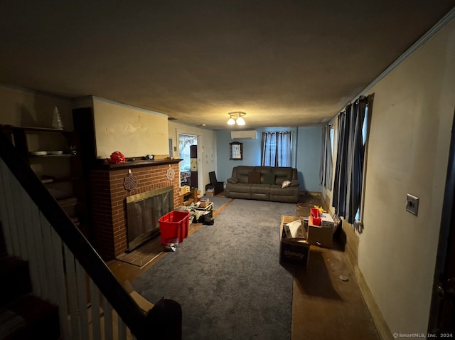 living room with a wall unit AC, crown molding, carpet floors, and a brick fireplace