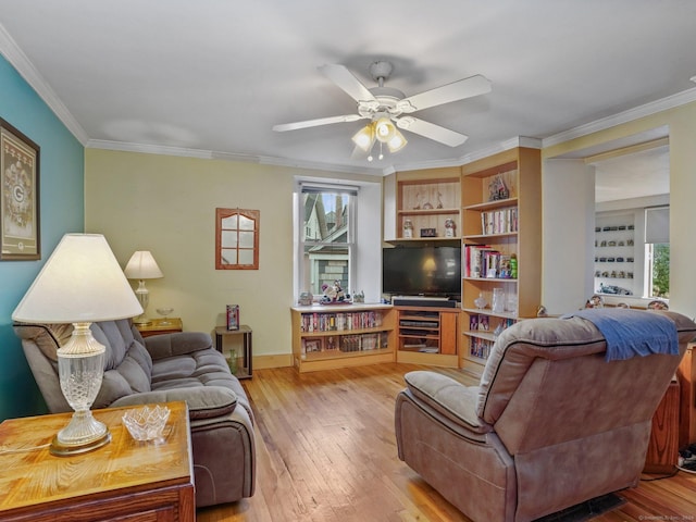 living room featuring light hardwood / wood-style floors, plenty of natural light, and ornamental molding