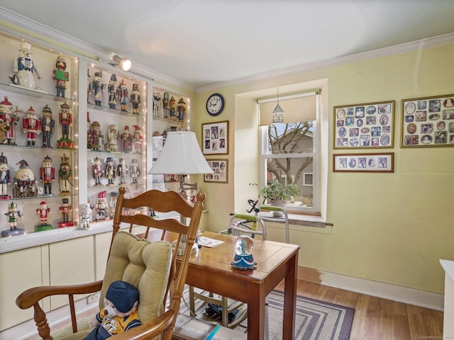 sitting room featuring hardwood / wood-style floors and ornamental molding