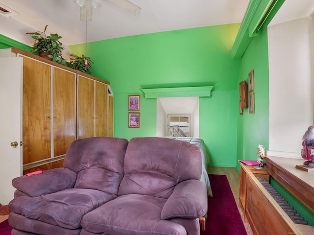 living room featuring ceiling fan and wood-type flooring