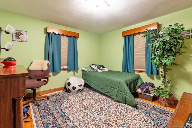 bedroom featuring wood-type flooring