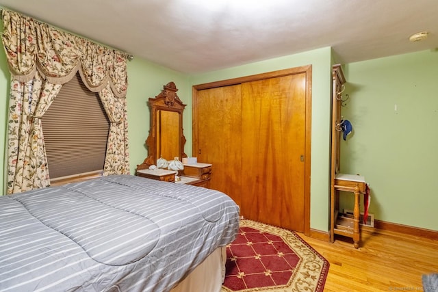 bedroom featuring a closet and hardwood / wood-style floors