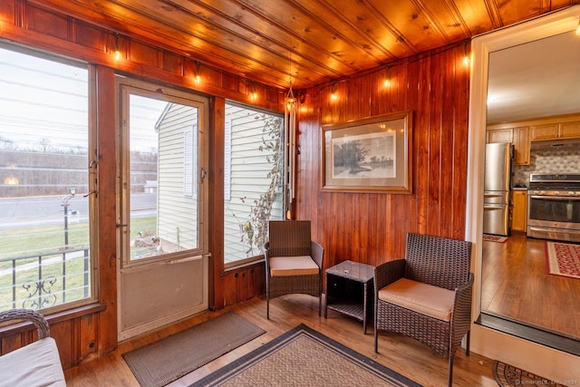 interior space with wooden ceiling and light hardwood / wood-style flooring